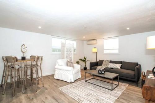 a living room with a couch and a table at North End Bungalows Downstairs in Boise