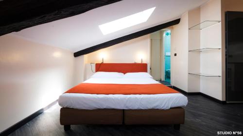 Una cama o camas en una habitación de Residence Sacchi Aparthotel