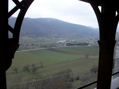 a view of a field from a window at La Loggia Di Federico in Navelli