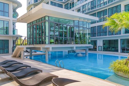 an image of a building with a swimming pool at Sea Zen Condominium Bang Saray in Bang Sare