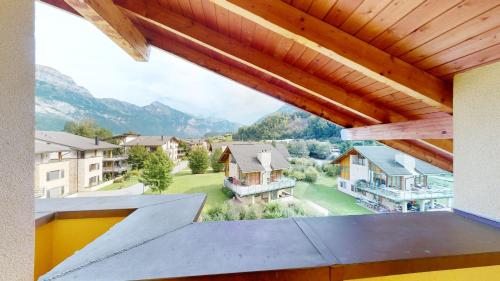 a view from the balcony of a house at Walensee House & Apartments in Unterterzen