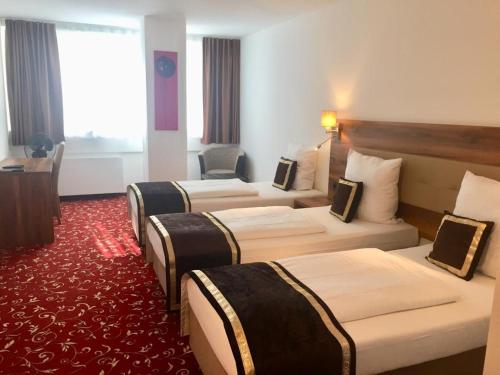 Postel nebo postele na pokoji v ubytování Hotel Luna