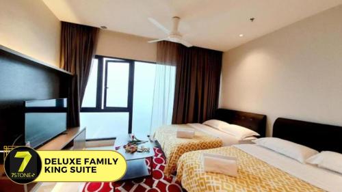Ένα ή περισσότερα κρεβάτια σε δωμάτιο στο 7Stonez Suites Geo38 Genting Highlands