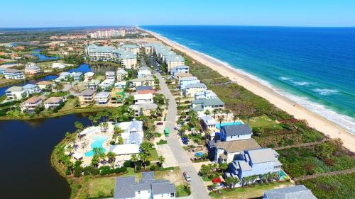 an aerial view of a resort next to the beach at SouthernVilla Ticket to Paradise in Palm Coast