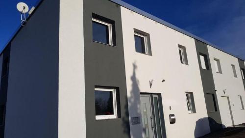 a shadow of a person standing outside of a building at Ferienwohnung-Irxleben in Irxleben