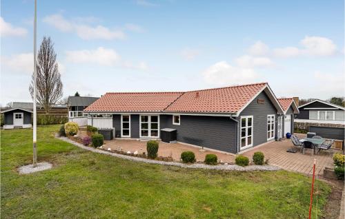 a house with a red roof at 4 Bedroom Awesome Home In Egernsund in Egernsund