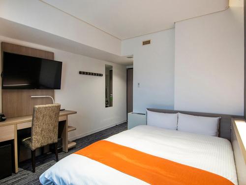 Postel nebo postele na pokoji v ubytování Niigata Daiichi Hotel
