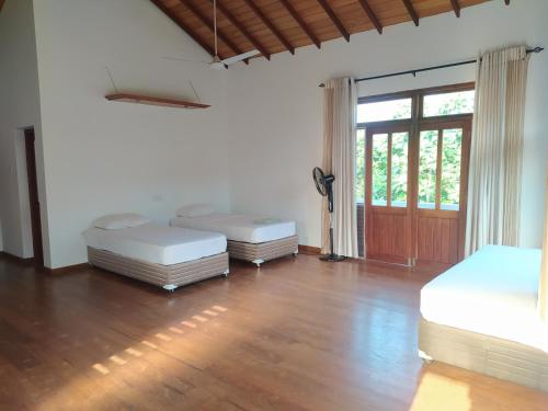 Ένα ή περισσότερα κρεβάτια σε δωμάτιο στο Hostel Residence Bentota