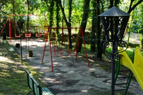 a row of playground equipment in a park at Miralago in Albano Laziale