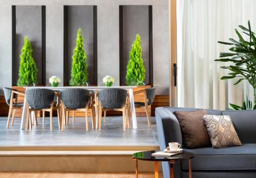 a living room with a table and chairs and a couch at The Ritz-Carlton, Istanbul at the Bosphorus in Istanbul