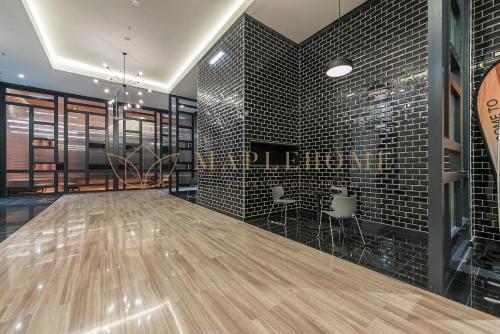 a dance floor in a room with black tiles at Chambers Premier Suites Kuala Lumpur in Kuala Lumpur