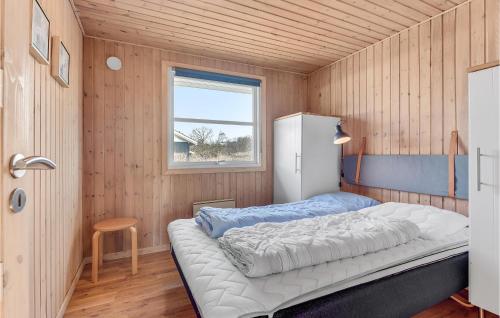 a bedroom with a bed in a room with a window at Beautiful Home In Egernsund With 3 Bedrooms And Wifi in Egernsund