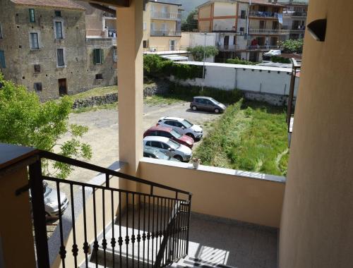 a balcony with cars parked in a parking lot at B&B Da Rosa Camerota in Camerota