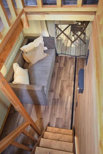 an overhead view of a bed in a tiny house at Camping Lacona Pineta in Capoliveri