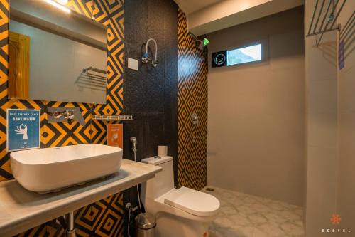 a bathroom with a sink and a toilet at Zostel Manali, Vashisht in Vashisht
