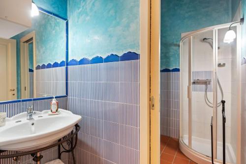 a bathroom with a sink and a shower at Borgo Bucciano in San Miniato