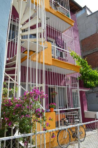 a colorful building with flowers in front of it at Shantihome in Izmir