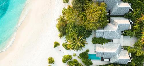 an aerial view of a resort on a beach at Heritance Aarah - Premium All Inclusive - 40 Minutes away from Male by Seaplane in Raa Atoll