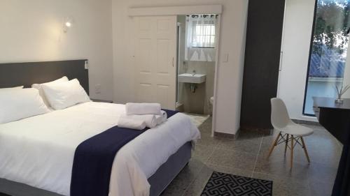 Ένα ή περισσότερα κρεβάτια σε δωμάτιο στο The Wishing Well Guest House Self-Catering