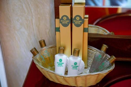 a basket with bottles of soap and detergents on a table at Greenlight Hotel in Dar es Salaam