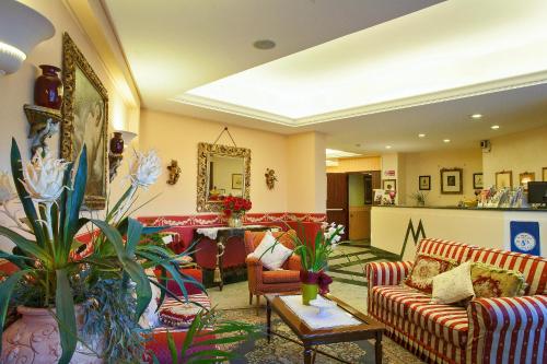 a living room with couches and a table at Miralago in Albano Laziale