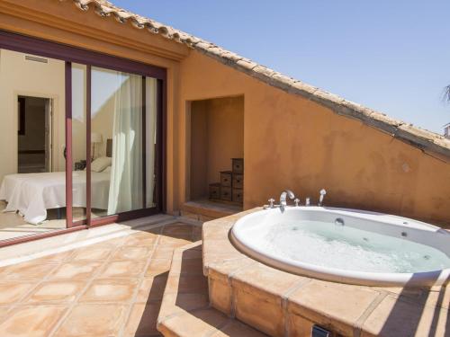 a bathroom with a bath tub on a patio at VACATION MARBELLA I Duplex con encanto bahía in Marbella