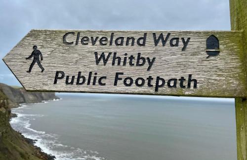 a sign that readsconservancy way wildlife public footpath at Robin Hood's Bay Coastguard's Cottage with a View in Robin Hood's Bay