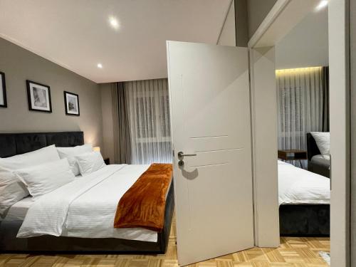 Postel nebo postele na pokoji v ubytování Premium Apartments