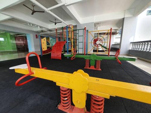 a childrens play area with play equipment in a room at Heritage 12 Homestay Studio 4Pax Free WIFI Netflix in Seri Kembangan
