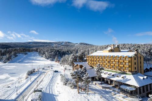 an aerial view of a hotel in the snow at Duja Chalet Ski Center in Sarıkamıs