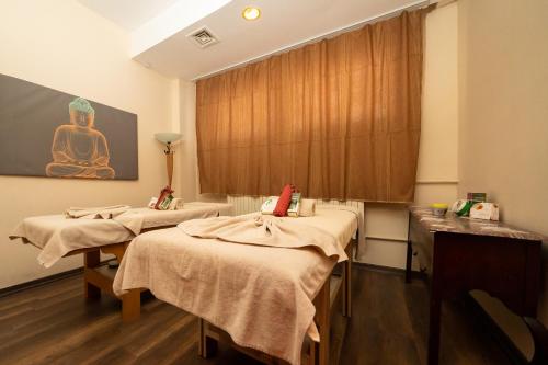 a hospital room with three beds and a window at Duja Chalet Ski Center in Sarıkamıs