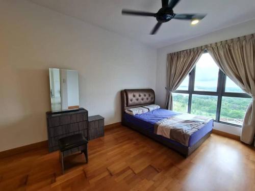 a bedroom with a bed and a ceiling fan at 2 bedder Seaview condo with Wifi near Legoland for 6 pax in Nusajaya