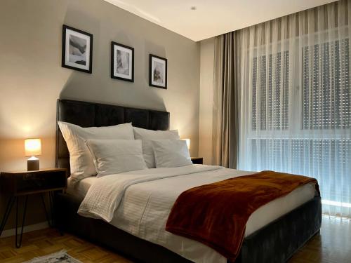 Postel nebo postele na pokoji v ubytování Premium Apartments