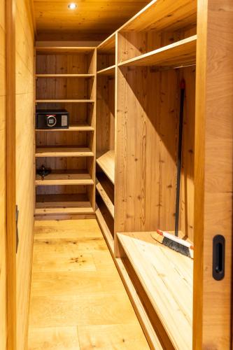 a wooden sauna with wooden shelves in a wooden house at Madlhof in Himmelreich