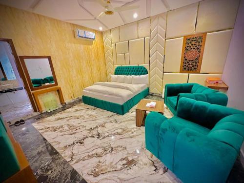 a living room with a couch and a table at The Signature Hotel Multan in Multan