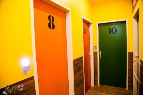 a hallway with two different colored doors in a room at BeFree Hostel - Self-Service in Vienna