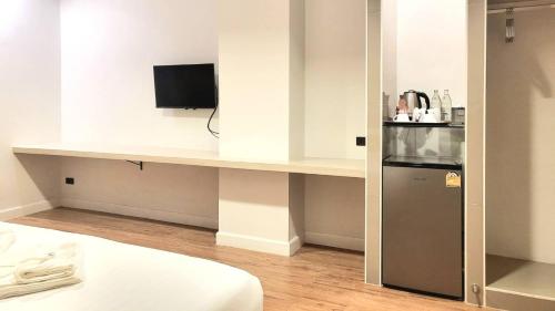 Kuchyň nebo kuchyňský kout v ubytování Manomon residence มโนมน เรสซิเดนซ์