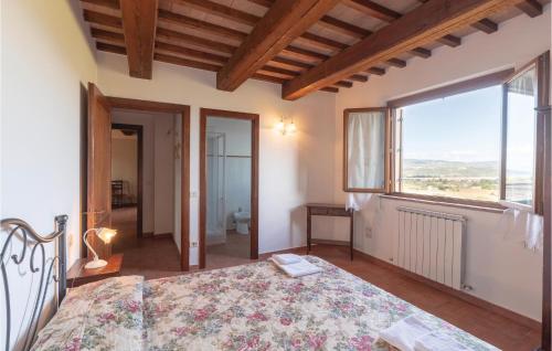 a bedroom with a bed and a large window at Seranna 4 in Papiano