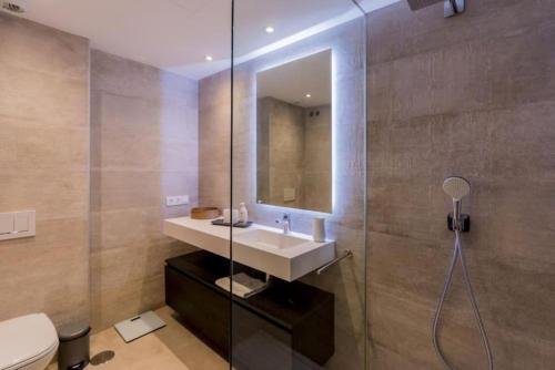 a bathroom with a sink and a shower at Al-1103 Estepona - Apartment - Alcazaba Lagoon in Estepona