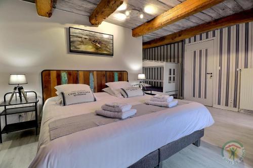 Säng eller sängar i ett rum på Le Haut Pont de la Baie