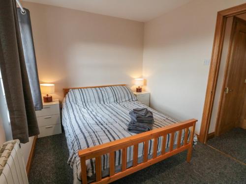 Llit o llits en una habitació de 3 Wilson Cottages