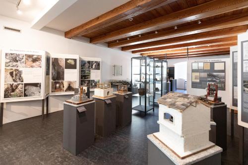 a museum exhibit with photographs and exhibits on display at Hotel Restaurant Stockalperturm in Ruden