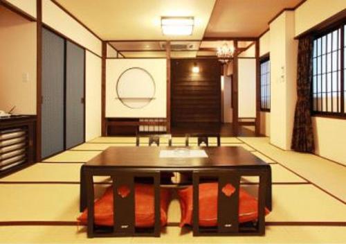 a room with a table in the middle of a room at Wakkanai Grand Hotel in Wakkanai