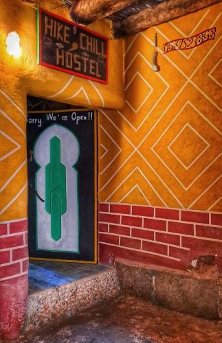 a wall with a sign that reads like a chill house at Hike and Chill Homestay in Tinerhir
