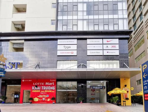 a building with signs on the side of it at Gold Coast Luxury Apartment Nha Trang in Nha Trang