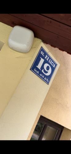 a sign on top of a room with a speed limit sign at Apart-Wita in Wadowice
