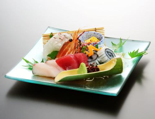 a plate of food with sushi on a table at Nara Park Hotel in Nara