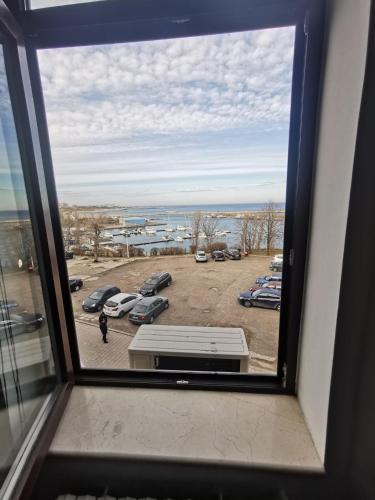 a view from a window of a parking lot at Great Black Sea View in Constanţa