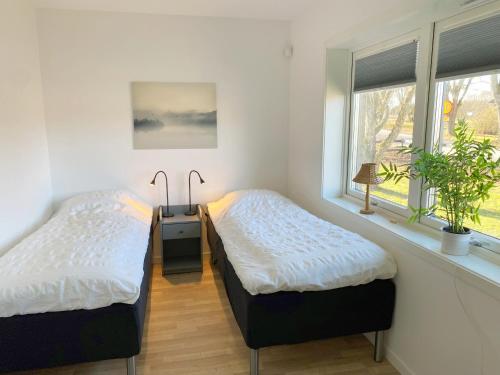 Postel nebo postele na pokoji v ubytování Well-equipped holiday home on Bolmso outside Ljungby