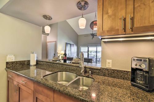 a kitchen with a sink and a counter top at Stunning South Maui Condo with Lanai by Beach! in Kihei